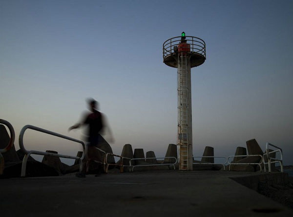 lighthouse and walker