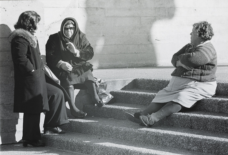 Women on steps, talking